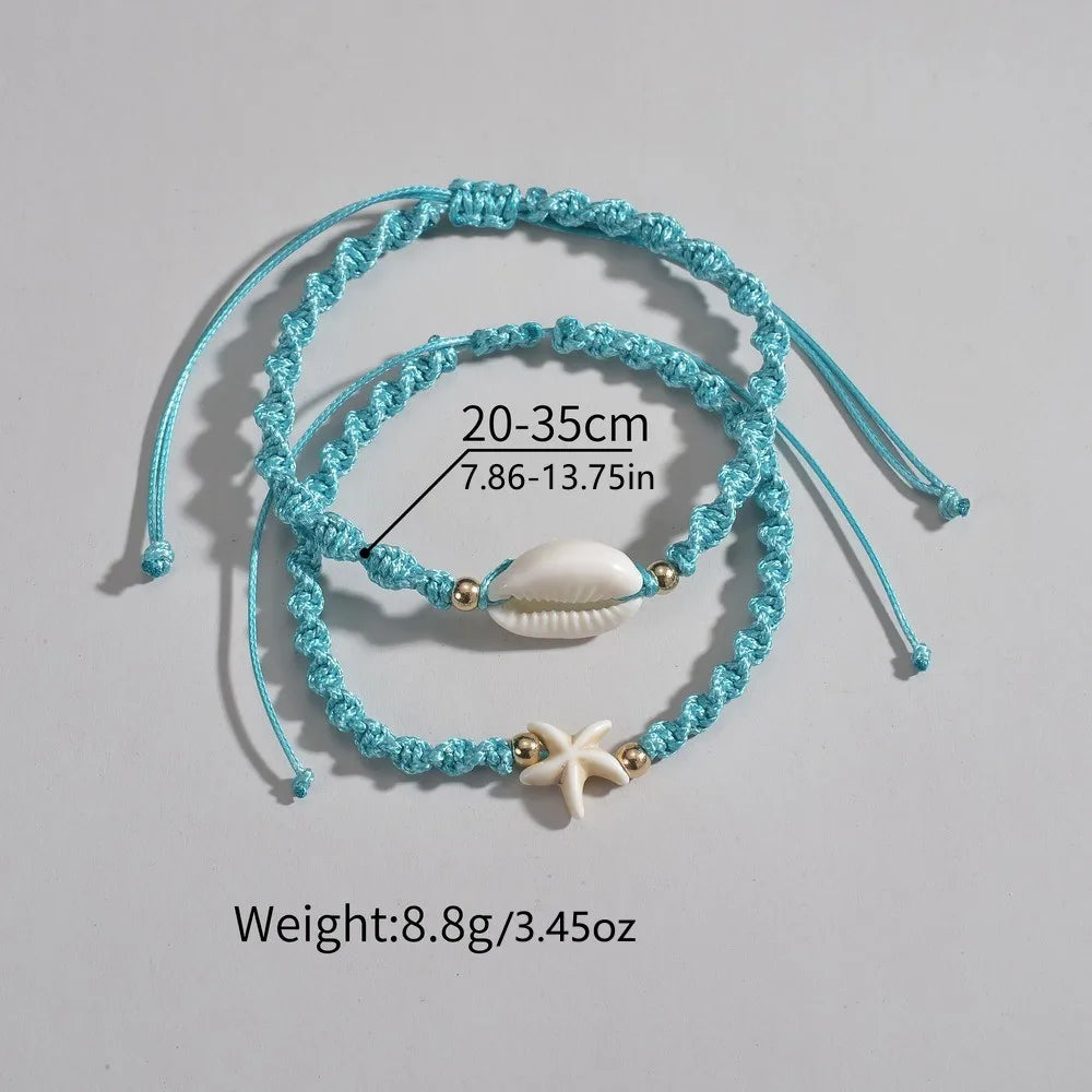 SHELLA - 
2-piece set of ocean style seashells, starfish, blue rope woven women's ankles